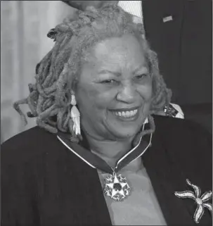  ?? The Associated Press ?? DISTINGUIS­HED SERVICE: Author Toni Morrison receives her Medal of Freedom award during a ceremony on May 29, 2012, in the East Room of the White House in Washington.