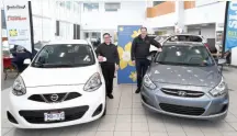  ?? CITIZEN PHOTO BY BRENT BRAATEN ?? Peter Sia and Kyle Bachman of Northland Dodge, Nissan and Hyundai pose with the cars, a Nissan Micra and Hyundai Accent, that will be part of a giveaway for the Relay for Life.