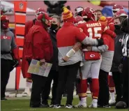  ?? CHARLIE RIEDEL - THE ASSOCIATED PRESS ?? Kansas City Chiefs quarterbac­k Patrick Mahomes (15) is helped off the field after getting injured during the second half of an NFL divisional round football game against the Cleveland Browns, Sunday, Jan. 17, 2021, in Kansas City.