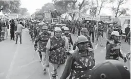  ?? — PTI ?? Security personnnel arrive at the Satlok Ashram for the arrest of Sant Rampal in Hisar on Monday.