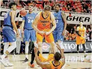  ?? [PHOTO BY BRYAN TERRY, THE OKLAHOMAN] ?? Oklahoma State’s Mitchell Solomon (41) celebrates with Tavarius Shine during a first-round NIT basketball game against Florida Gulf Coast on Tuesday at Gallagher-Iba Arena in Stillwater.