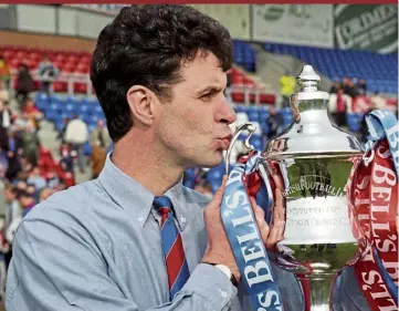  ?? ?? Steve Paterson with the Third Division championsh­ip trophy in 1997.