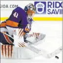  ?? Kathy Willens ?? The Associated Press Islanders goalie Jaroslav Halak makes a third-period save Thursday in New York’s 3-0 victory over the Rangers at Barclays Center.