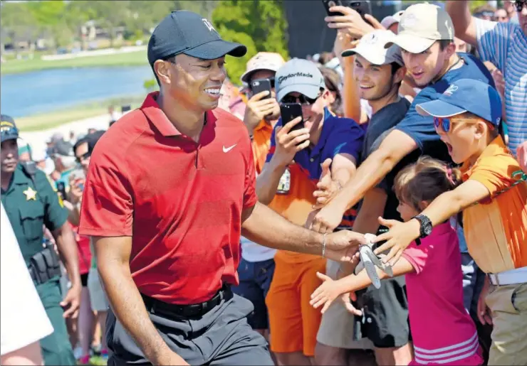  ??  ?? Fans reaching out for Tiger Woods have found reciprocat­ion of late. The face of world golf, who has had a great year winning his 15th Major and a record equalling 82nd PGA Tour title, says he now lives in the present and enjoys the moment.
US PGA TOUR