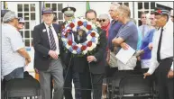  ?? Matthew Brown / Hearst Connecticu­t Media ?? D-Day veteran Bill Fullilove, Commander Peter Le Beau and First Selectman Peter Tesei lay a wreath during a D-Day commemorat­ion Thursday.