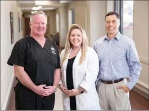  ?? Submitted photo ?? NEW SURGEON: Dr. James Kevin Rudder, left, has joined the staff of Orthopaedi­c Clinic of Hot Springs. With him is Jennifer Jones, ANP, and Richard Planzo, ANP.