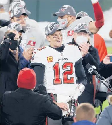  ?? DYLAN BUELL/GETTY ?? Tom Brady soaks it all in after the Buccaneers’victory over the Packers in the NFC championsh­ip game Sunday.