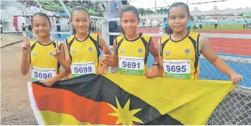  ??  ?? Luciana Urai Simon, Benardine Christy Lepin, Karen Rejie and Dolly Uring Jau celebrate after winning the Girls U-12 4x200m relay.