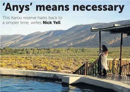  ?? NICK YELL ?? WILD HEART: Annette Theron soaks up the view of the Anysberg from the ‘plaasdam’ and deck