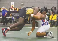  ?? H John Voorhees III / Hearst Connecticu­t Media ?? Danbury's Jordan Agosto and New Haven's Jaylin Houston wrestle in the finals in the 285-pound weight class in the State Open championsh­ip.