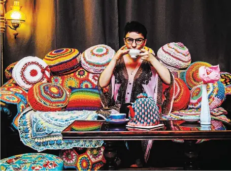  ?? KSENIJA HOTIC ?? Ivy Knight at home with her colourful crocheted pillows.