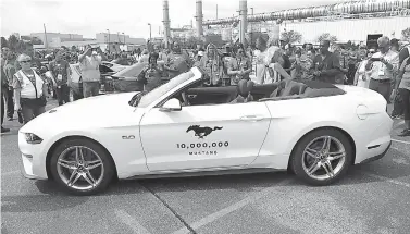  ?? AP Photo/Carlos Osorio ?? ■ A 2019 GT Mustang, the 10 millionth Mustang built by Ford, is displayed Wednesday at the Flat Rock Assembly plant in Flat Rock, Mich.