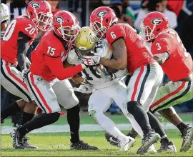  ?? CURTIS COMPTON / CCOMPTON@AJC.COM ?? Georgia’s J.R. Reed (from left), D’Andre Walker, Natrez Patrick and Roquan Smith swarm Tech quarterbac­k TaQuon Marshall during last year’s 38-7 win.