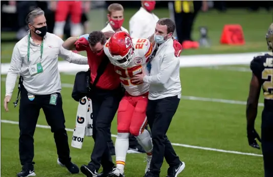  ?? AP Photo/Brett Duke ?? Kansas City Chiefs running back Clyde Edwards-Helaire (25) is helped off the field after being injured in the second half of an NFL football game against the New Orleans Saints in New Orleans, on Dec. 20.