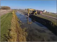  ?? ?? A view of the Irwin Drain as it flows through the air base.