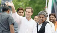  ?? — AFP ?? Congress President Rahul Gandhi waves at a protest rally called by the Dalit community over an amendment to a law that protects the rights of the group in New Delhi on Thursday.