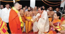  ??  ?? HYDERABAD: This handout picture released by the Public Relation Department of the Government of Telangana and taken on November 24, 2016 shows Telangana Chief Minister K Chandrashe­khar Rao (center) taking part in a ritual to inaugurate his new home. —...