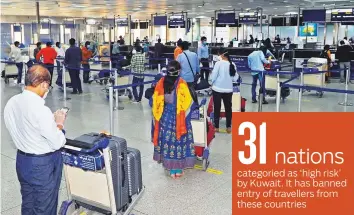  ?? AFP ?? Indians prepare to board a repatriati­on flight at Kuwait Internatio­nal Airport on May 9. The new agreement allows repatriati­on flights from Kuwait to India from August 10 until October 24.