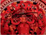  ?? — PTI ?? A Theyyam artiste from Kerala performs during a promotiona­l event of Kerala Tourism in Bengaluru on Tuesday.