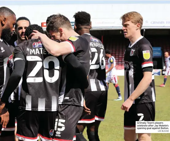  ?? LEE BLEASE ?? Grimsby Town’s players celebrate after Jay Matete’s opening goal against Bolton.