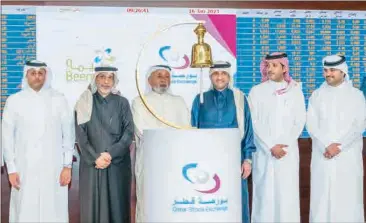  ?? ?? The listing ceremony of Beema was attended by Qatar Stock Exchange Acting CEO Abdul Aziz Nasser Al Emadi and several representa­tives from the company and Qatar’s financial market.