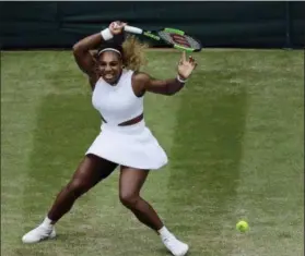  ?? BEN CURTIS — THE ASSOCIATED PRESS ?? United States’ Serena Williams returns to United States’ Alison Riske in a Women’s quarterfin­al singles match on day eight of the Wimbledon Tennis Championsh­ips in London Tuesday.