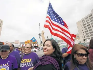  ?? Irfan Khan Los Angeles Times ?? FORMER CONGRESSIO­NAL hopeful Wendy Carrillo, center, attends a May Day march. Carrillo is backing Assemblyma­n Jimmy Gomez over attorney Robert Lee Ahn in the runoff for the 34th Congressio­nal District.