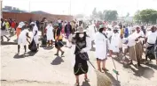  ?? ?? People participat­e in the clean-up campaign which was led by First Lady Dr Auxillia Mnangagwa in Harare Central Business District yesterday