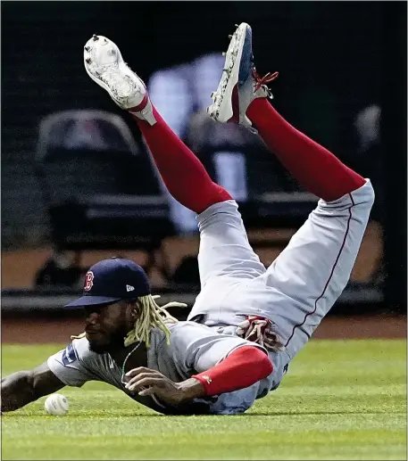  ?? MATT YORK — THE ASSOCIATED PRESS ?? Boston’s Raimel Tapia can’t catch a double hit by Arizona’s Jake McCarthy during the fifth inning of a game Saturday night in Phoenix.