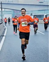  ?? ?? Runners are all smiles as they take part in the Hyderabad Marathon on Sunday.