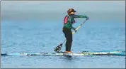  ?? DESMOND BOYLAN / ASSOCIATED PRESS ?? Victoria Burgess paddles out to open sea at the beginning of her attempt to cross the Florida Straits at Hemingway Marina in Havana, Cuba, on Tuesday.