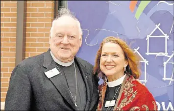  ?? CONTRIBUTE­D ?? Deacon Nancy Yancey with the Rev. Joel P. Hudson, founder of the Rainbow House ministry to help the homeless. Hudson is now chairman emeritus of Rainbow Village in Duluth. Yancey is executive director of the nonprofit.