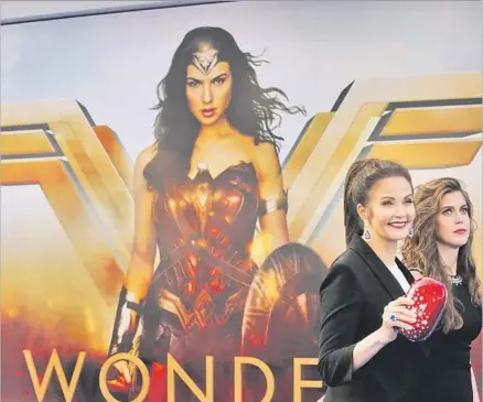  ?? Photograph­s by Genaro Molina Los Angeles Times ?? LYNDA CARTER, left, who played Wonder Woman in a 1970s television series, and her daughter, Jessica Altman, attend the premiere of the movie “Wonder Woman” at the Pantages Theatre in Hollywood on Thursday. The film stars Gal Gadot in the title role.