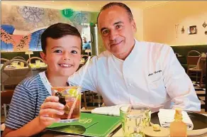  ?? Tommy Kelly / Contribute­d photo ?? Instagram star and TV personalit­y Leo Kelly, left, of @TheShirley­TempleKing fame at Happy Monkey on Greenwich Avenue with chef Jean-Georges Vongericht­en.