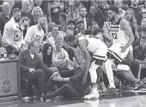  ?? JOE CAMPOREALE/USA TODAY SPORTS ?? Minnesota Timberwolv­es coach Chris Finch sustained a ruptured patellar tendon in his right knee during a sideline collision Sunday night.