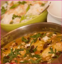  ??  ?? Delicious and creamy fruity chicken curry with toasted almonds.