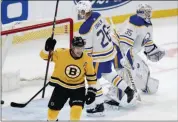  ?? MICHAEL DWYER - STAFF, AP ?? Boston Bruins’ Charlie Coyle, foreground, celebrates a goal by Matt Grzelcyk against Buffalo Sabres’ goalie Linus Ullmark during the second period of Saturday’s game in Boston.