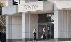  ?? Associated Press file photo ?? Two women walk into the JCPenney store in Peabody, Mass., in 2019. J.C. Penney filed for Chapter 11 in May and announced plans to permanentl­y close nearly a third of its 846 stores.