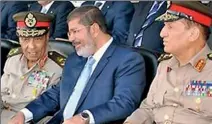  ??  ?? Relations between President Mursi (centre) and Egypt's two top generals have been tense (BBC)