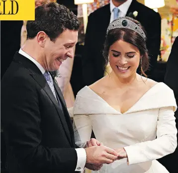  ?? JONATHAN BRADY/AFP/GETTY IMAGES ?? Britain’s Princess Eugenie of York receives the ring from Jack Brooksbank during their star-studded wedding ceremony at Windsor’s St. George’s Chapel Friday, a day that included such celebritie­s as Liv Tyler and Naomi Campbell.