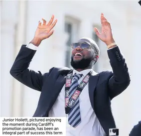  ??  ?? Junior Hoilett, pictured enjoying the moment during Cardiff’s promotion parade, has been an integral part of success this term