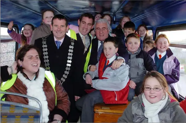  ??  ?? May 2005 - Cllr Maryin Bellew Chairman Dundalk Town Council William and Veronica Martin Dundalk Recycling centre with Dick Roche Minister for the environmen­t and children from Redeemer and Realt Na Mara NS on the recycled bus.