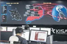  ?? [YUN DONG-JIN/YONHAP VIA AP] ?? Employees watch electronic boards to monitor possible ransomware cyberattac­ks at the Korea Internet and Security Agency in Seoul, South Korea. Unable to rely on good human behavior, computer security experts are developing software techniques to fight...