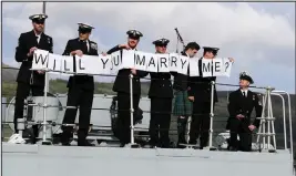  ??  ?? Petty Officer Mark Titman with the help of colleagues proposes to Laura Campbell, and above right, the couple celebrate in style