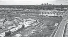  ?? DORAL CHENOWETH/COLUMBUS DISPATCH ?? The Columbus Castings site, has been cleared of all buildings and is awaiting redevelopm­ent in this aerial photo. Parsons Avenue is at right, and the Downtown skyline is at the top.