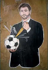  ??  ?? “The failed coup”…a graffiti depicting Agnelli appeared near the Italian Football Federation’s headquarte­rs in Rome