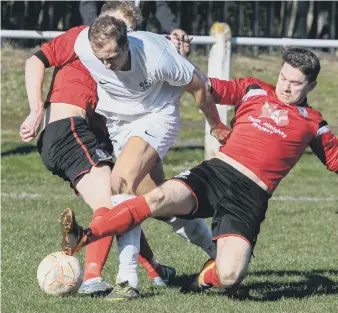  ??  ?? Silksworth CW (red) battle against South Shields Reserves on Saturday. Pictures by Kevin Brady