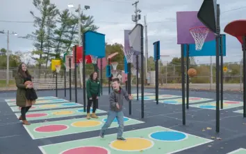  ?? Allegheny County Department of Parks ?? Reid Fazzone, a Southpoint­e Grizzlies Special Hockey player, at the opening ceremony of the new Bankshot basketball court in South Park.