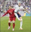  ?? ?? Megan Rapinoe of the U.S. and Vietnam’s Thi Van Duong battle for the ball in the second half.