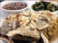  ?? Special to the Democrat-Gazette/CARLA KOEN ?? Nealie Mae’s Cornbread Dressing can be served with chicken and comes with two sides like purple hull peas and greens at TAE in Little Rock.